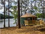 View larger image of A yurt set up by the river at STONE MOUNTAIN PARK CAMPGROUND image #3
