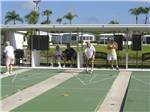 View larger image of Couples playing shuffleboard at FORT MYERS BEACH RV RESORT image #6