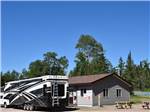 Class A Motorhome parked on-site at STILLWATER TENT & RV PARK - thumbnail