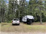 Travel trailer parked on-site at STILLWATER TENT & RV PARK - thumbnail