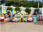A group of kids in the swimming pool at JELLYSTONE PARK ™ AT BIRCHWOOD ACRES - thumbnail