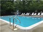Lounge chairs around the pool at PRINCE WILLIAM FOREST RV CAMPGROUND - thumbnail