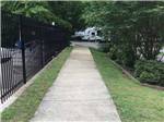 A concrete walkway by the pool at PRINCE WILLIAM FOREST RV CAMPGROUND - thumbnail