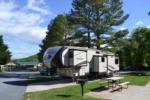 An RV parked in a paved site - thumbnail