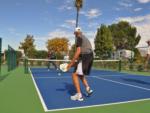 Men playing pickle ball at GOLDEN VILLAGE PALMS RV RESORT - thumbnail