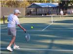 Couple playing tennis at ENCORE RAMBLERS REST - thumbnail
