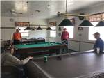 View larger image of A group of people playing pool at MCALLEN MOBILE PARK image #11