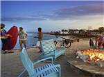 People on the beach next to a large fire pit at BIG PINE KEY RESORT - thumbnail