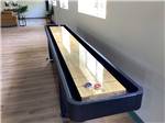 A shuffleboard table in the rec room at Vinton RV Park - thumbnail