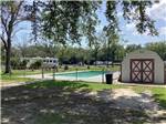 A shed next to the swimming pool at Vinton RV Park - thumbnail