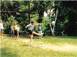 View larger image of A girl kicking a soccer ball at CAMP TOODIK FAMILY CAMPGROUND CABINS  CANOE LIVERY image #10