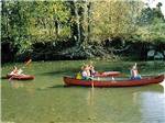 View larger image of A group of kids in canoes at CAMP TOODIK FAMILY CAMPGROUND CABINS  CANOE LIVERY image #11