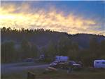 View larger image of Trailers and trucks camping at sunset at PAGOSA RIVERSIDE CAMPGROUND image #5
