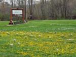 Park sign in a field of flowers at Susquehanna Trail Campground - thumbnail