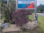 The sign at the entrance of the park at Port Orford RV Village - thumbnail