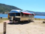 An RV parked in a lakefront site - thumbnail