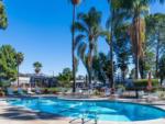 Lounge chairs around the swimming pool at VACATIONER RV PARK - thumbnail