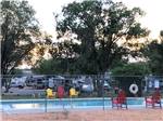 The fenced in swimming pool at DIXIE FOREST RV RESORT BY RJOURNEY - thumbnail