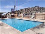The fenced in swimming pool at CEDAR CITY RV RESORT BY RJOURNEY - thumbnail
