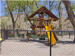 The kids playground equipment at CEDAR CITY RV RESORT BY RJOURNEY - thumbnail