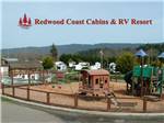 View larger image of The playground equipment at REDWOOD COAST CABINS  RV RESORT image #1