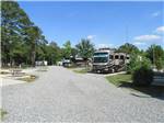 View larger image of Gravel road leading into RV park at AMERICAMPS RV RESORT image #8