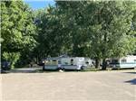 A group of trailers under trees at LANSING COTTONWOOD CAMPGROUND - thumbnail