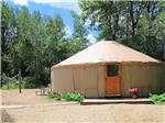 View larger image of One of the yurts with a volleyball net at BARABOO RV RESORT image #7