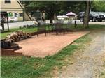 View larger image of One of the patios with a fire pit at CALHOUN AOK CAMPGROUND image #4