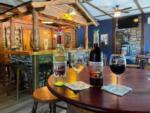 Local wines on the table at the rustic bar at WHIPPOORWILL MOTEL & CAMPSITES - thumbnail