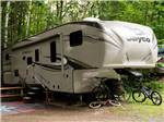 A fifth wheel set up on-site at LAKE GEORGE CAMPING VILLAGE - thumbnail