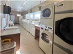 Washers and dryers in the laundry room at LARAMIE RV RESORT BY RJOURNEY - thumbnail