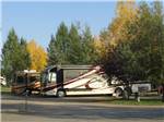 View larger image of Big rigs parked in sites among trees at PHILLIPS RV PARK image #2