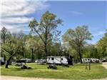 A group of grassy RV sites at SUNSETVIEW FARM CAMPING AREA - thumbnail