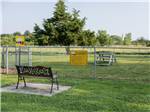 Bench seating by the dog park - thumbnail