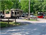 View larger image of Big rig towing a pickup through park at NORTHERN KY RV PARK image #5