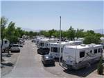 An aerial view of a row of RVs at HITCHIN' POST RV PARK - thumbnail
