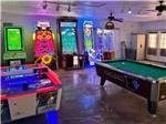 Rec room with air hockey and pool table at Walnut Hills Campground and RV Park - thumbnail