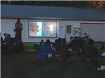 Outdoor movie at Walnut Hills Campground and RV Park - thumbnail