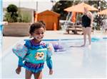 View larger image of A little girl at the splash pad at SUN OUTDOORS CAPE CHARLES image #7