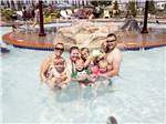 View larger image of A family standing in the pool at SUN OUTDOORS CAPE CHARLES image #11