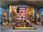 Wooden statues of military people at USA RV PARK - thumbnail