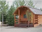 A rental cabin surrounded by trees at CORTEZ RV RESORT BY RJOURNEY - thumbnail