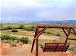 A swing to look at the mountains at CORTEZ RV RESORT BY RJOURNEY - thumbnail