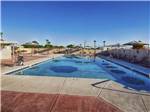 The swimming pool area at CARAVAN OASIS RV RESORT - thumbnail