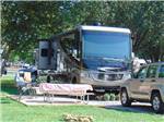 View larger image of A motorhome parked in a site with a picnic table at RACCOON MOUNTAIN CAMPGROUND AND CAVERNS image #2