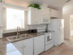 Kitchen in mobile home at Sun Resorts & Residences Fort Myers Beach - thumbnail