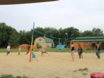 Group of people playing sand volleyball at BUTTERFLY CAMPING RESORT - thumbnail