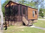 A rental cabin with an enclosed porch at LAKE CITY CAMPGROUND - thumbnail