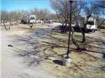 An empty gravel site between two parked travel trailers at BENSON KOA JOURNEY - thumbnail